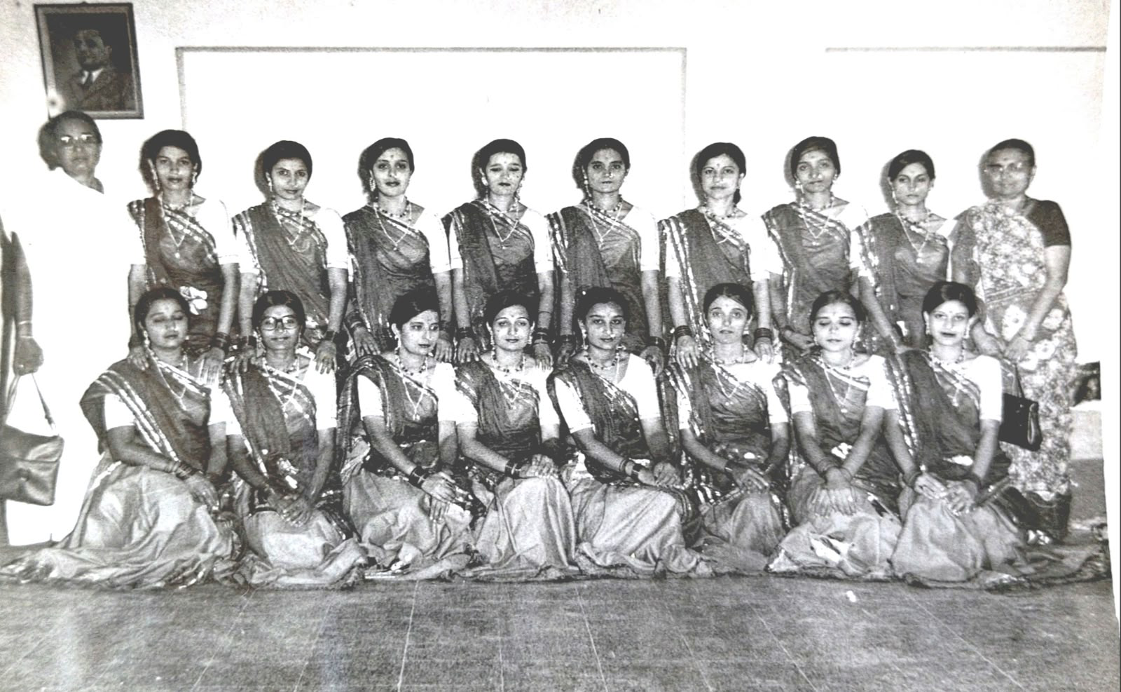Sixteen dancers in matching costume, an older woman at each end. Undated. Do you recognise anyone?
